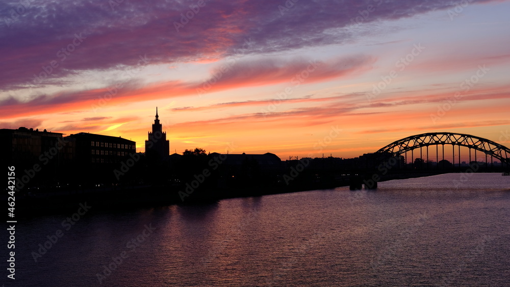 Fototapeta premium Railway bridge in Riga against the background of dawn in autumn.