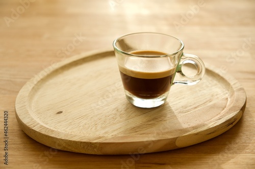 cup of coffee on wooden table