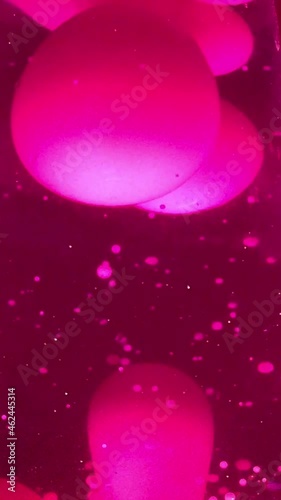 Lava lamp closeup 70s style pink lava liquid background stock footage with copy space