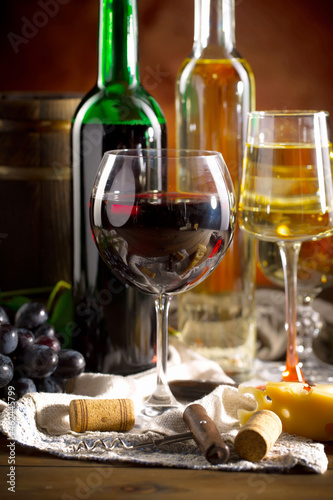 Fototapeta Naklejka Na Ścianę i Meble -  Wine in a glass on an old background