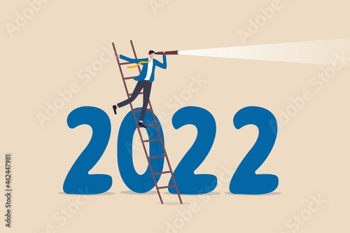 Year 2022 economic outlook, forecast or visionary to see future ahead, challenge and business opportunity concept, smart businessman climb up ladder to see through telescope on year 2022 number.