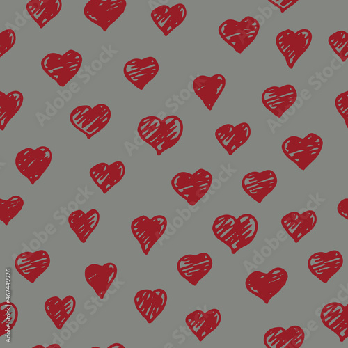 Vector red doodle hearts on a grey background seamless pattern. Hand drawn, fun and lighthearted design. Perfect for fabric, wallpaper, scrapbooking and stationery.