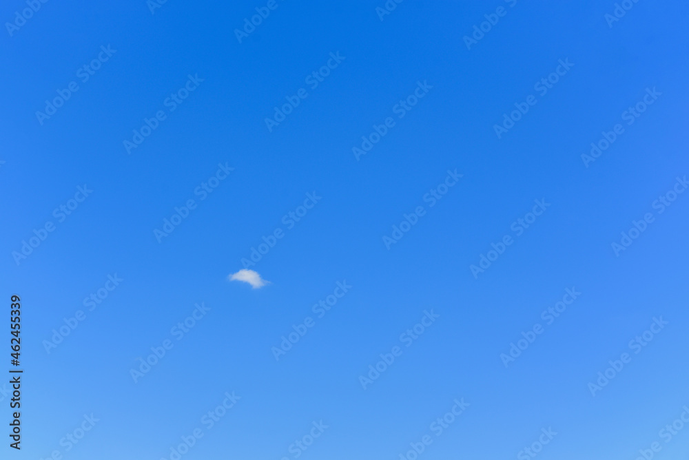 There is a lonely little cloud in the clear sky with copy space for text There is a lonely little cloud in the clear sky with copy space for text