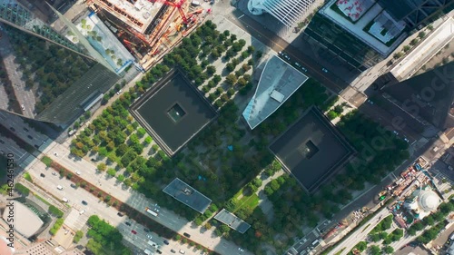 Overhead view on green park and fountains dedicated to the 911 memorial in lower Manhattan area of New York city, USA. Aerial 4K World Trade Center, 911 Museum in memory of September 11, 2001 tragedy photo