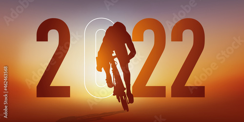 Concept du sport sur le thème du cyclisme pour une carte de vœux 2022, montrant un cycliste qui sprint pour passer la ligne d’arrivée.