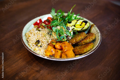 side dish with juicy vegan cutlet, vegetables in a plate