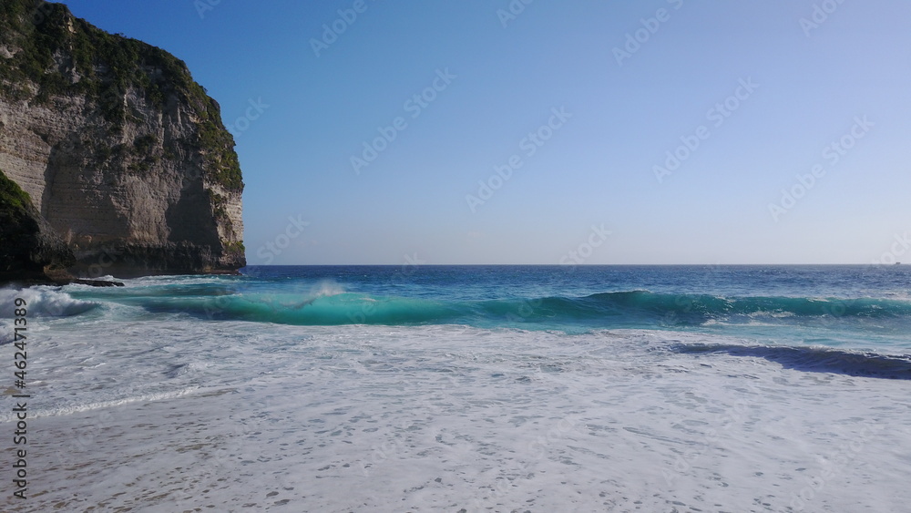 Fototapeta premium Ocean Wave Nusa perfect paradise desert beach exotic Indonesia Island blue colors tons afternoon calm relax morning sun sunny day Bali coast travel vacation montain