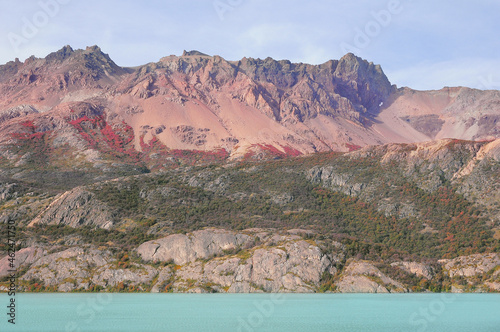 Colorful volcanic mountain by the lake. Los huemules park. photo