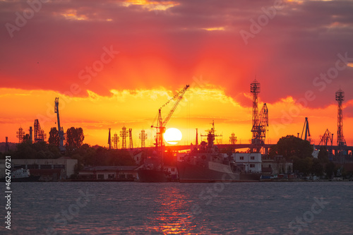 Sunset over sea port and industrial cranes, Varna