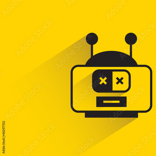 robot head with shadow on yellow background