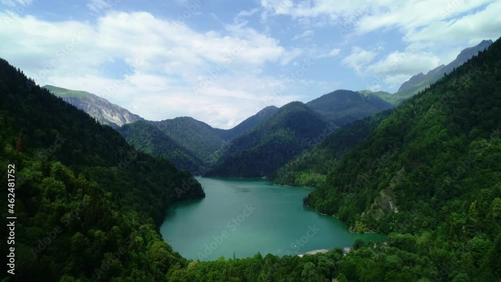 Aerial shot of beautiful alpine lake Ritsa , View from Above on Gorgeous Lake Ritsa between mountains in Nation Park, clear water, pristine nature. 4K UHD Aerial shot of beautiful alpine lake Ritsa , View from Above on Gorgeous Lake Ritsa between mountains in Nation Park, clear water, pristine nature. 4K UHD