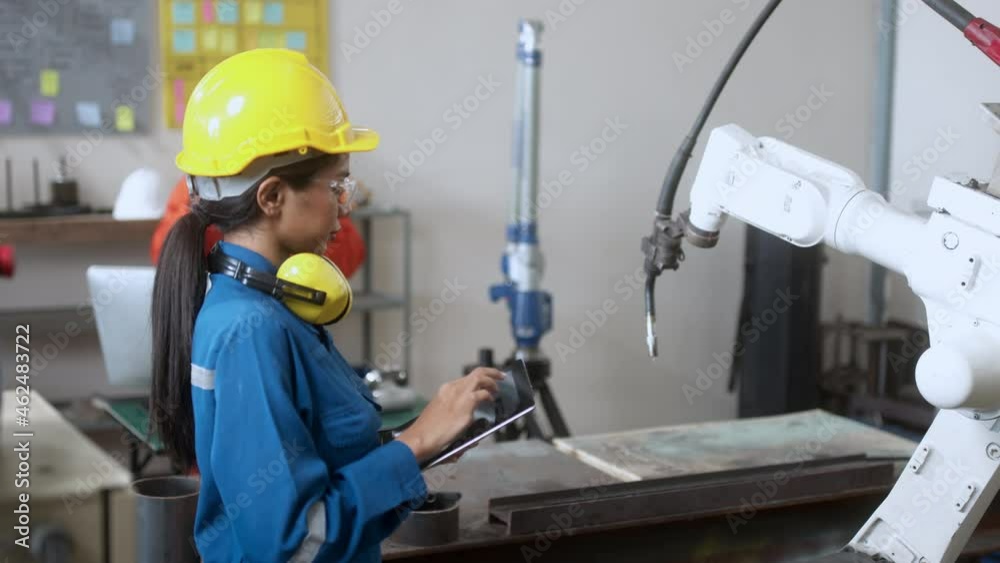 specialist technical engineer hand input programing code data computing to manage movement work flow of robotarm welding machinery in workshop modern factory smart industrial manufacture concept specialist technical engineer hand input programing code data computing to manage movement work flow of robotarm welding machinery in workshop modern factory smart industrial manufacture concept