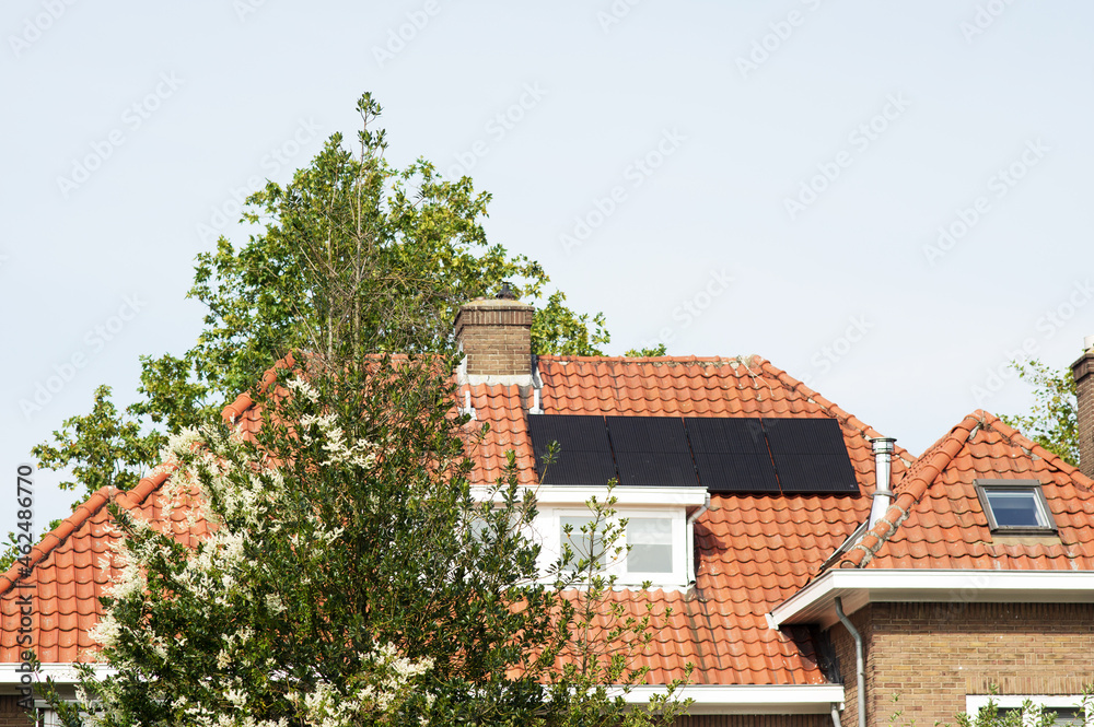 Solar panels on a red roof for electric power generation