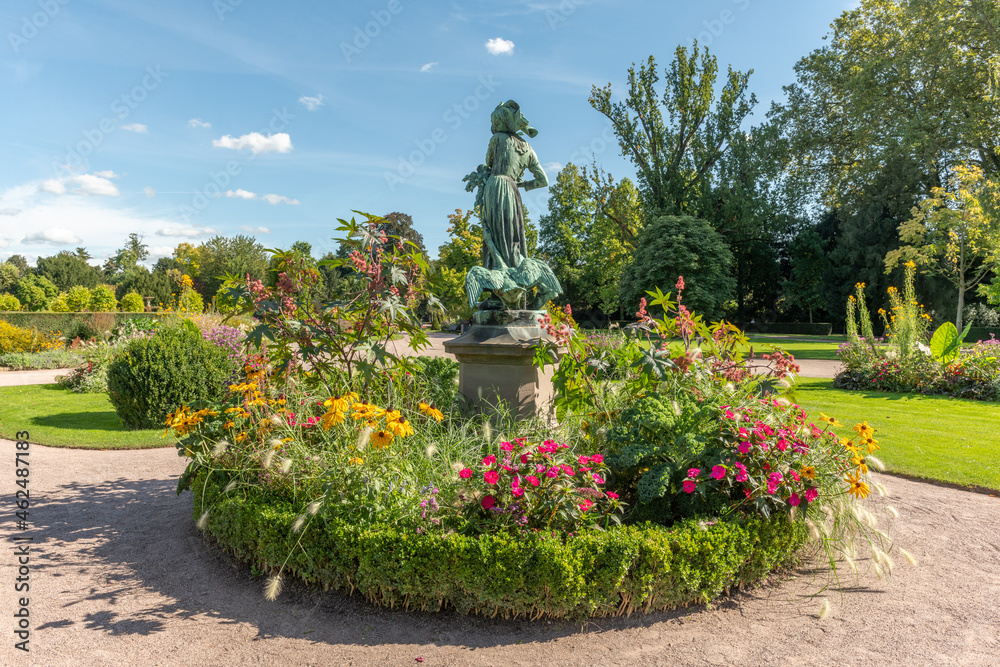 Fototapeta premium Statue of 'Lison with geese' in the park of the orangery in Strasbourg.