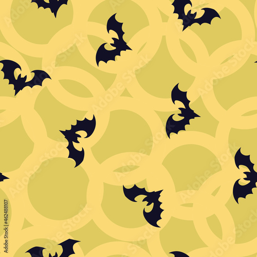 abstract background of cartoon images of bats on a pale yellow background for prints on fabrics  packaging and for background decoration of other illustrations