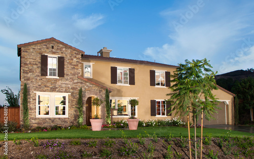 New Home with landscaping at dusk housing project  © fshortphotos