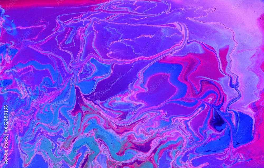 Abstract purple marble background. Acrylic paint mixes freely and creates an interesting pattern. Bright saturated shades. Background for the cover of a laptop, laptop.