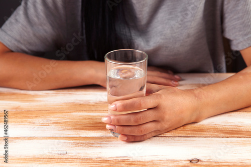 Woman in hand a glass of water