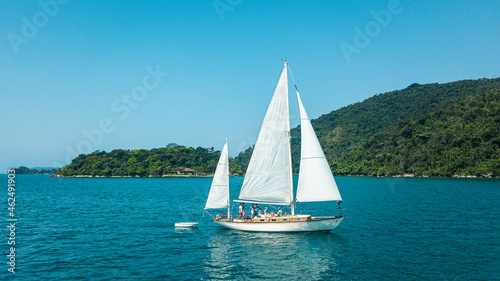 Beautiful classic sailboat sailing through the Paraty Bay, Rio de Janeiro, Brazil.