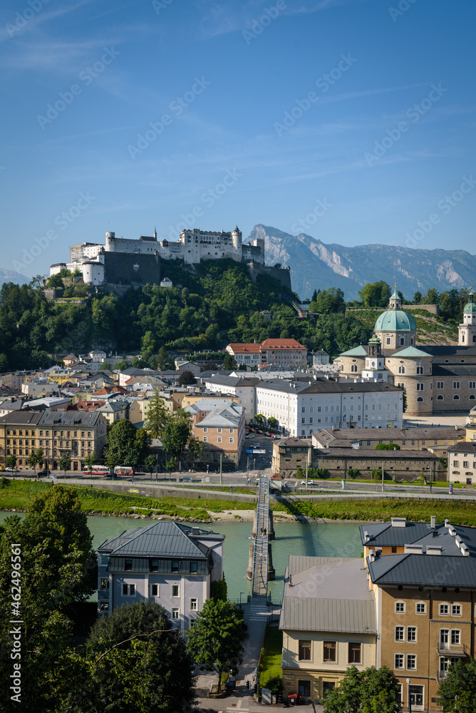 Naklejka premium View of Salzburg, the river Salzach and the mountains from the old Kapuzinerberg wall on a sunny summer day, Austria