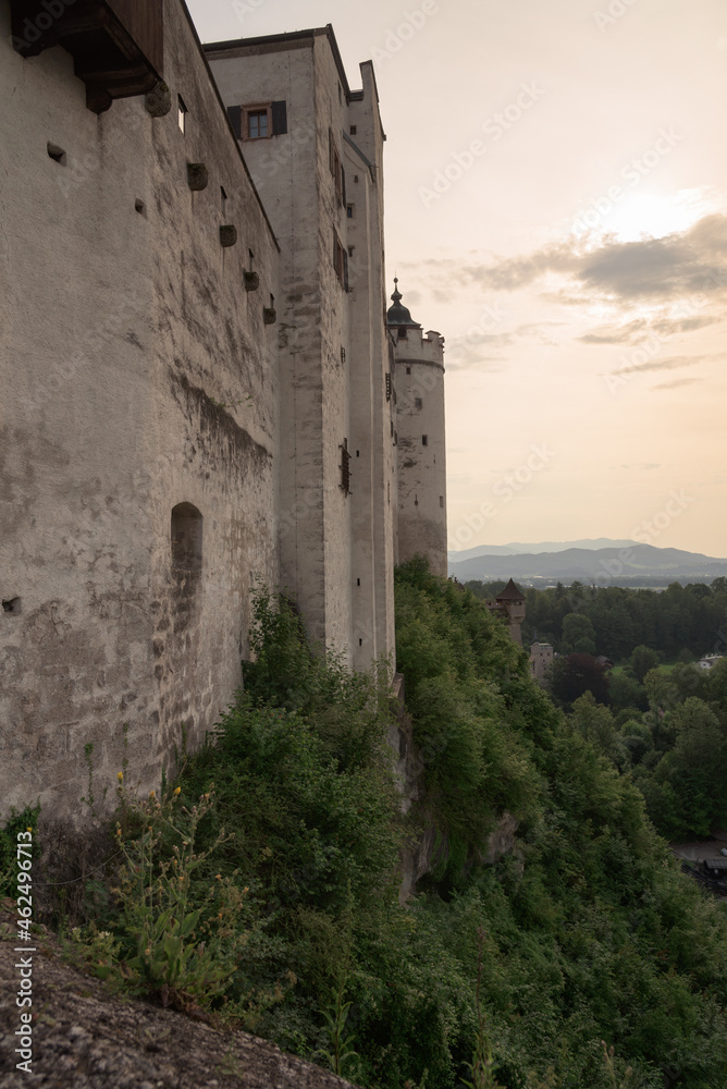 Hohensalzburg medieval castle from the 11th century on top of the hill on a summer day with hazy sky, Salzburg, Austria, Europe Hohensalzburg medieval castle from the 11th century on top of the hill on a summer day with hazy sky, Salzburg, Austria, Europe