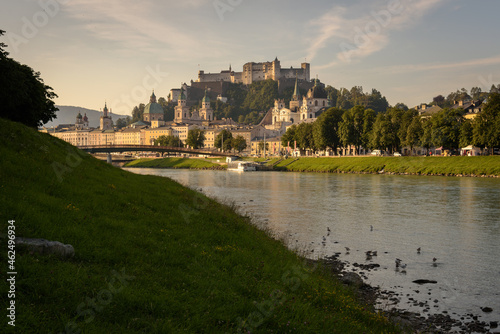 Panoramic view of Salzburg skyline with river Salzach in summertime at sunrise  Austria