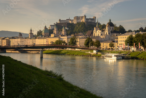 Panoramic view of Salzburg skyline with river Salzach in summertime at sunrise, Austria