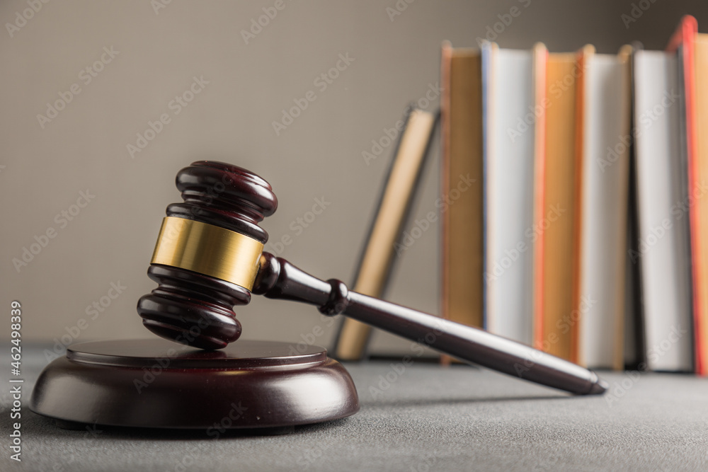 Law theme, judge gavel on a dark table with a book. Law theme, judge gavel on a dark table with a book.