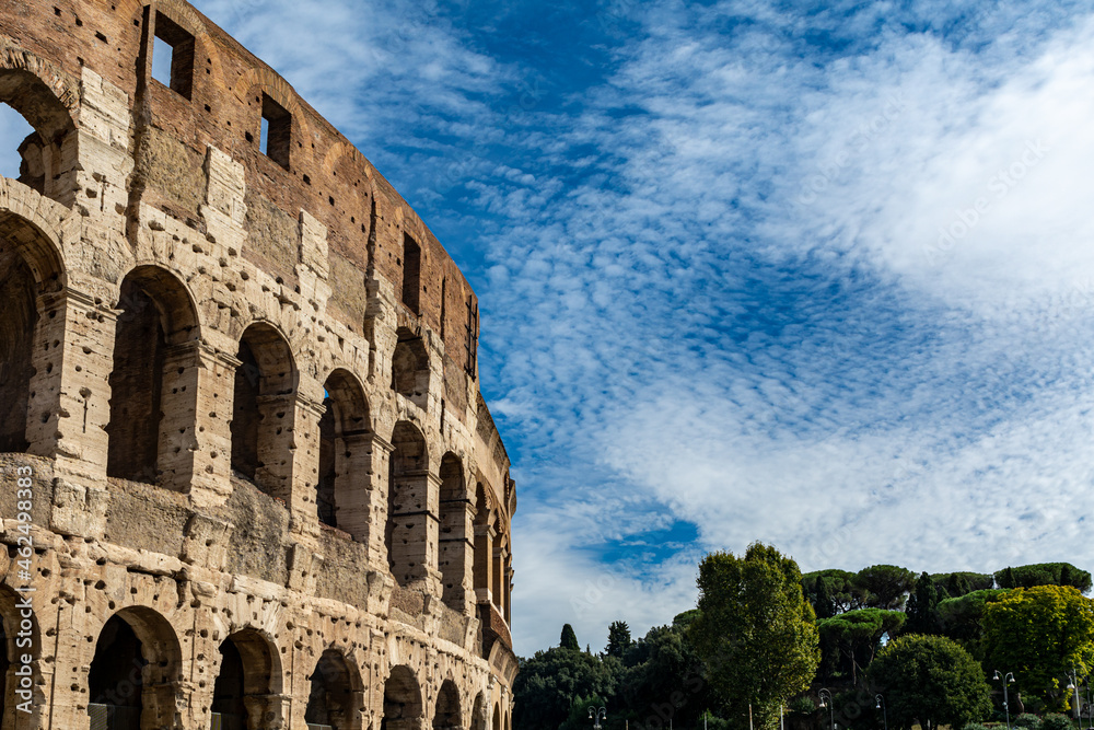 Detail of the Colosseum (Coliseum) in Rome, Italy. It is the main tourist attraction of Rome. Ancient Roman architecture and ruins of Rome in sunlight. 
