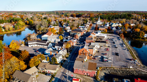 Aerial view of small coastal new england maine town - main street with white church