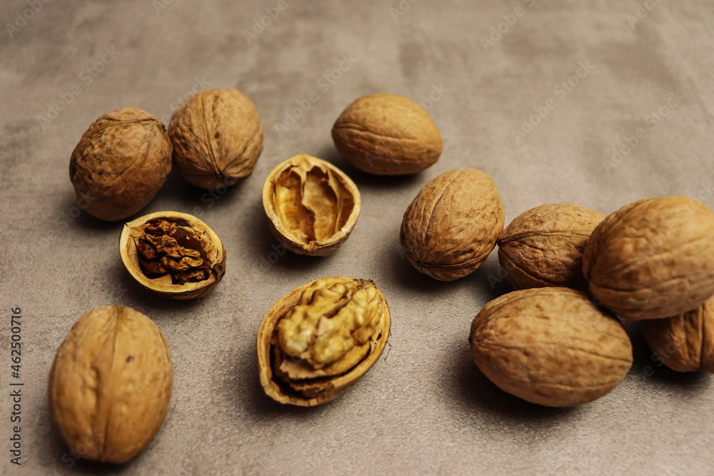 Beautiful food background with walnuts on brown table Beautiful food background with walnuts on brown table