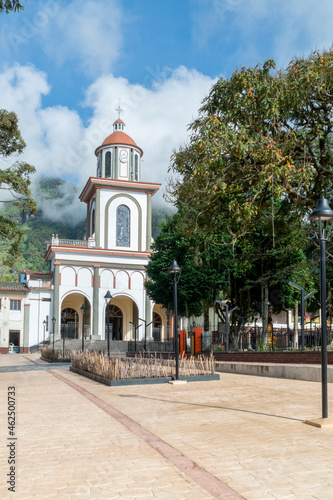 Tamesis, Antioquia, Colombia. June 22, 2020: San Antonio de Tamesis parish with trees and blue sky.