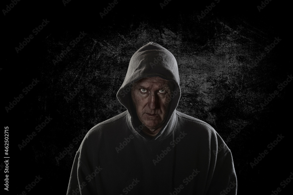 Criminal looking man wearing hoodie Criminal looking man wearing hoodie