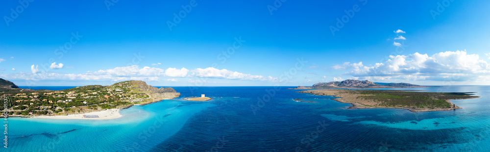 View from above, aerial shot, stunning panoramic view of La Pelosa Beach and the Asinara island bathed by a turquoise, crystal clear water. Spiaggia La Pelosa, Stintino, north-west Sardinia, Italy.