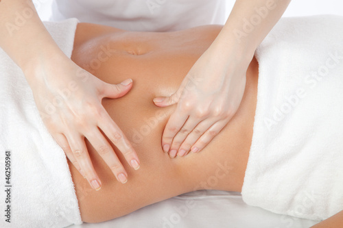 Young women having stomach massage © IR