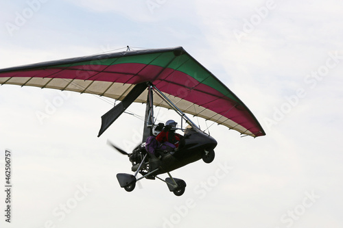Valokuva Ultralight airplane flying in a blue sky
