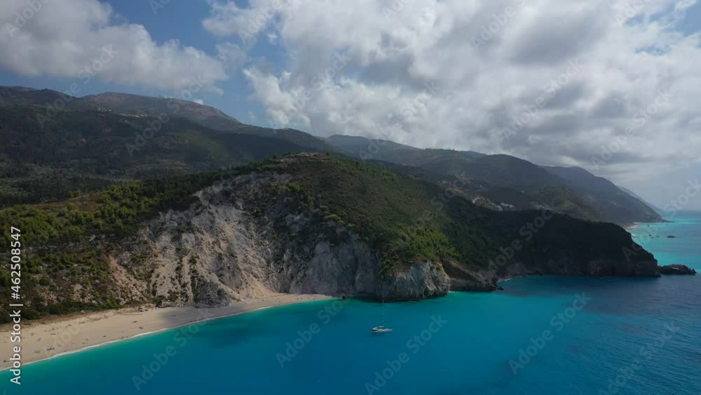 Aerial drone video of tropical paradise turquoise beach with beautiful sky and clouds in Mediterranean destination Aerial drone video of tropical paradise turquoise beach with beautiful sky and clouds in Mediterranean destination