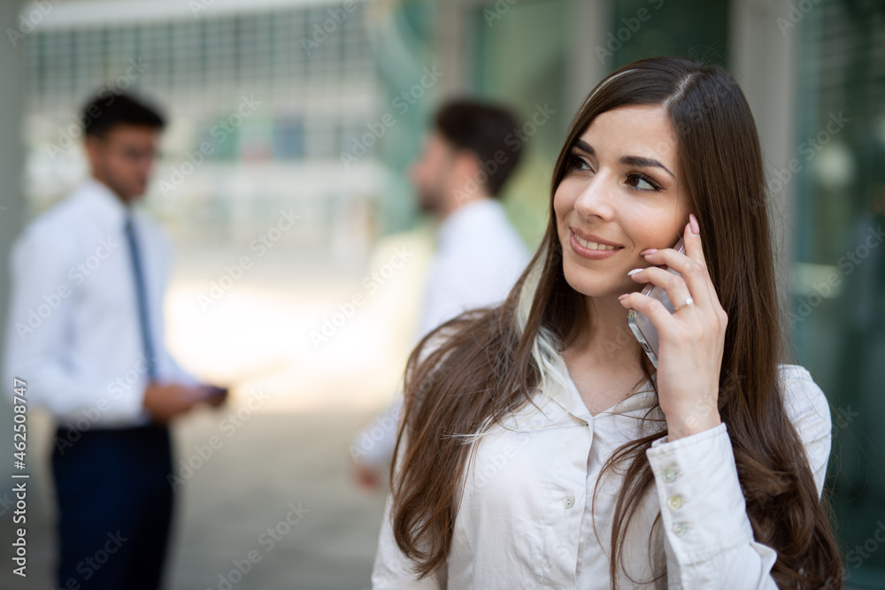 Businesswoman talking on the cellphone Businesswoman talking on the cellphone