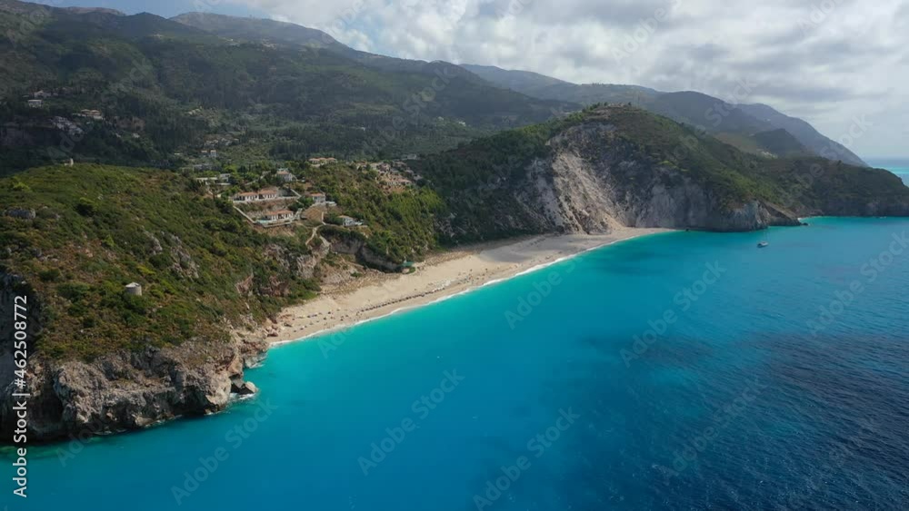 Aerial drone video of iconic beach and bay of Milos with turquoise clear sea in island of Lefkada, Ionian, Greece Aerial drone video of iconic beach and bay of Milos with turquoise clear sea in island of Lefkada, Ionian, Greece