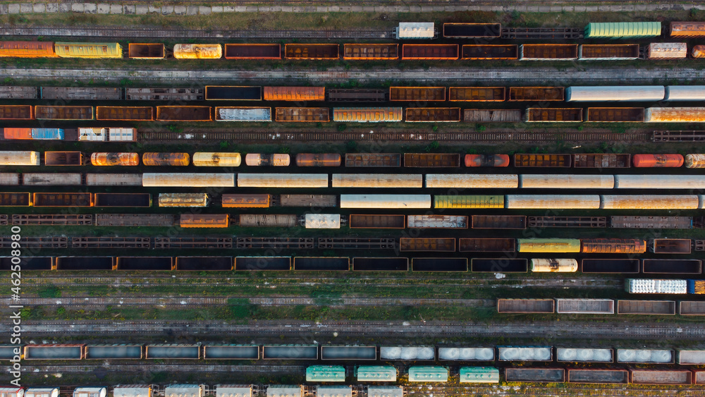 Aerial View. Old defective and looted railway wagons stand on the territory of the repair depot awaiting repairs. Poor business management. Ukrainian railway, DVRZ.