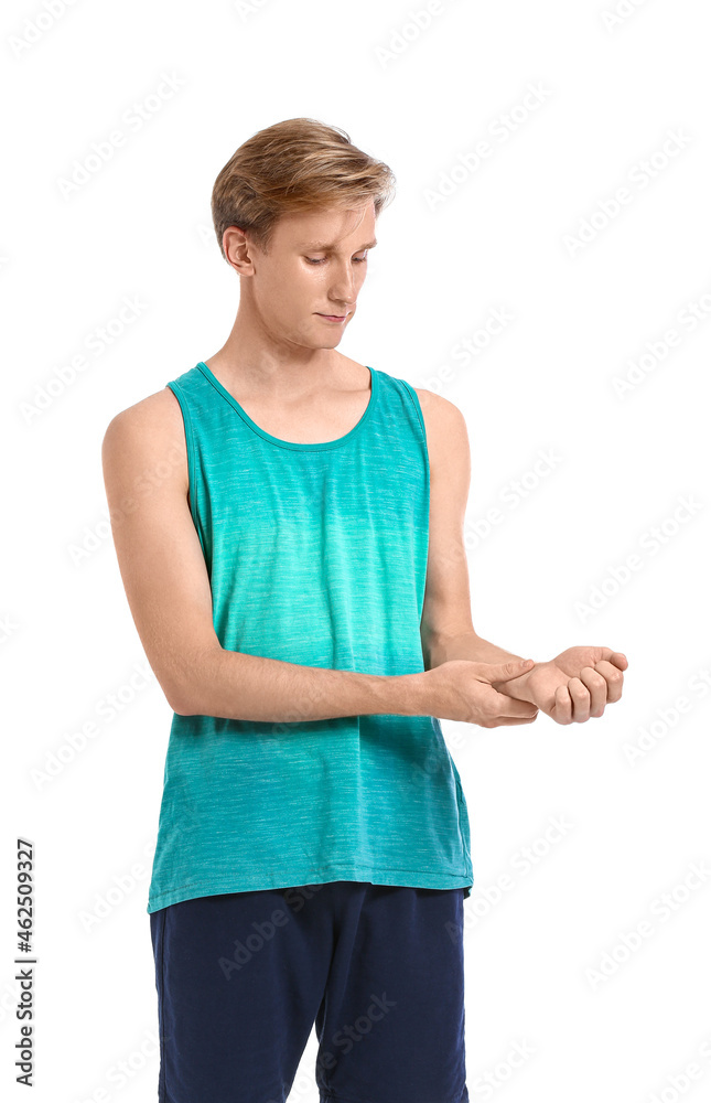 Sporty young man counting pulse on white background Sporty young man counting pulse on white background