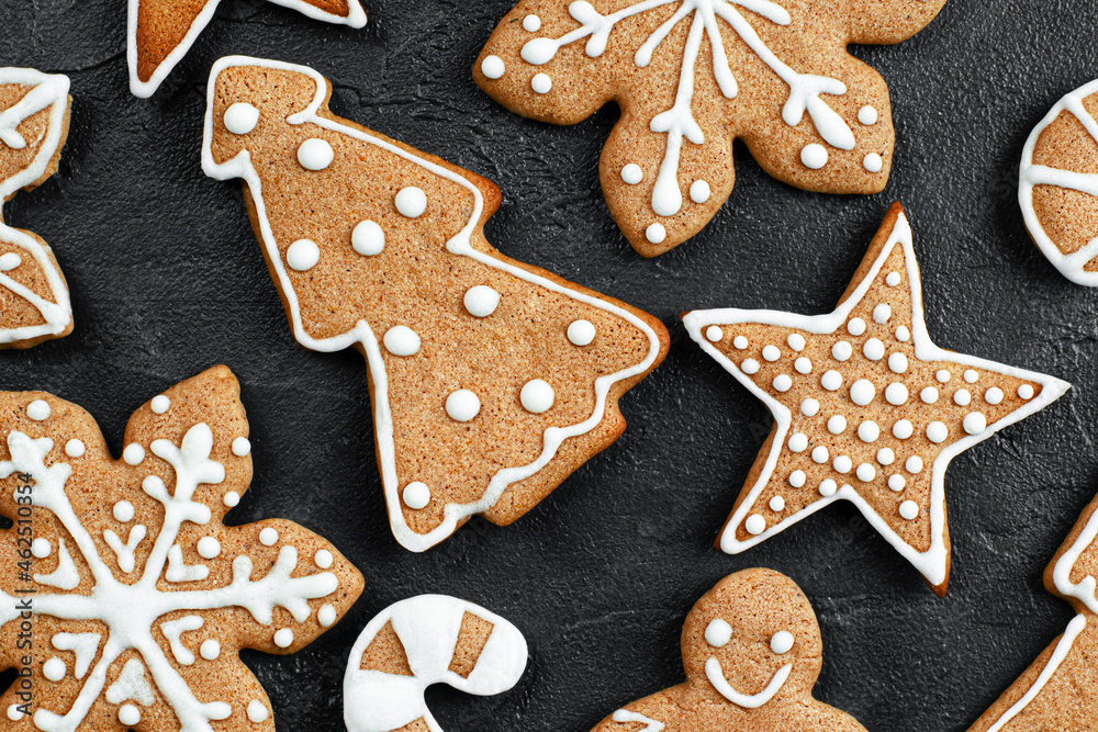 decorated christmas gingerbread cookie on dark background