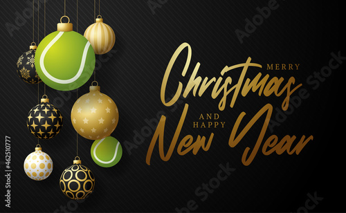 tennis Christmas card. Merry Christmas sport greeting card. Hang on a thread Tennis ball as a xmas ball and golden bauble on black horizontal background. Sport Vector illustration.