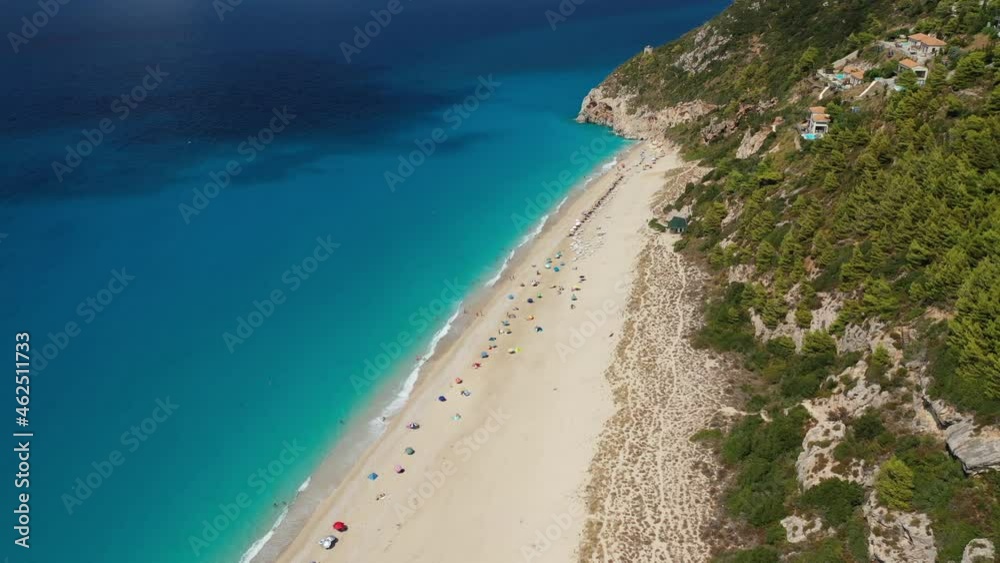 Aerial drone video of iconic beach and bay of Milos with turquoise clear sea in island of Lefkada, Ionian, Greece Aerial drone video of iconic beach and bay of Milos with turquoise clear sea in island of Lefkada, Ionian, Greece