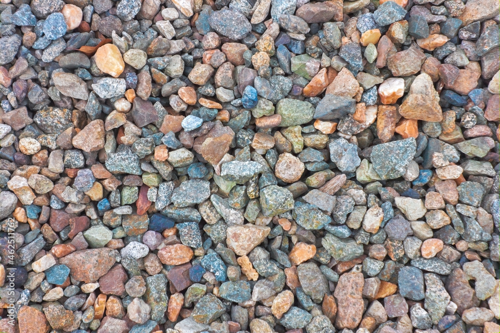 Crushed granite texture close-up. Background made of a closeup of a pile of crushed stone. Crushed granite texture close-up. Background made of a closeup of a pile of crushed stone.