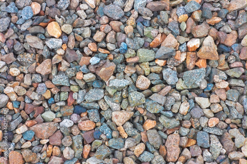 Crushed granite texture close-up. Background made of a closeup of a pile of crushed stone.