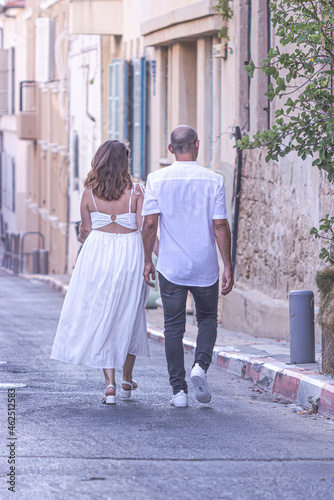 bride and groom walking in the street