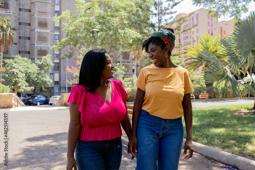 African American friends talking in the park
