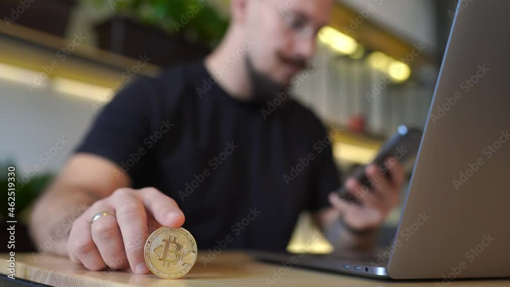 select focus hand of investor holds digital currency. investment information buy or sell bitcoin