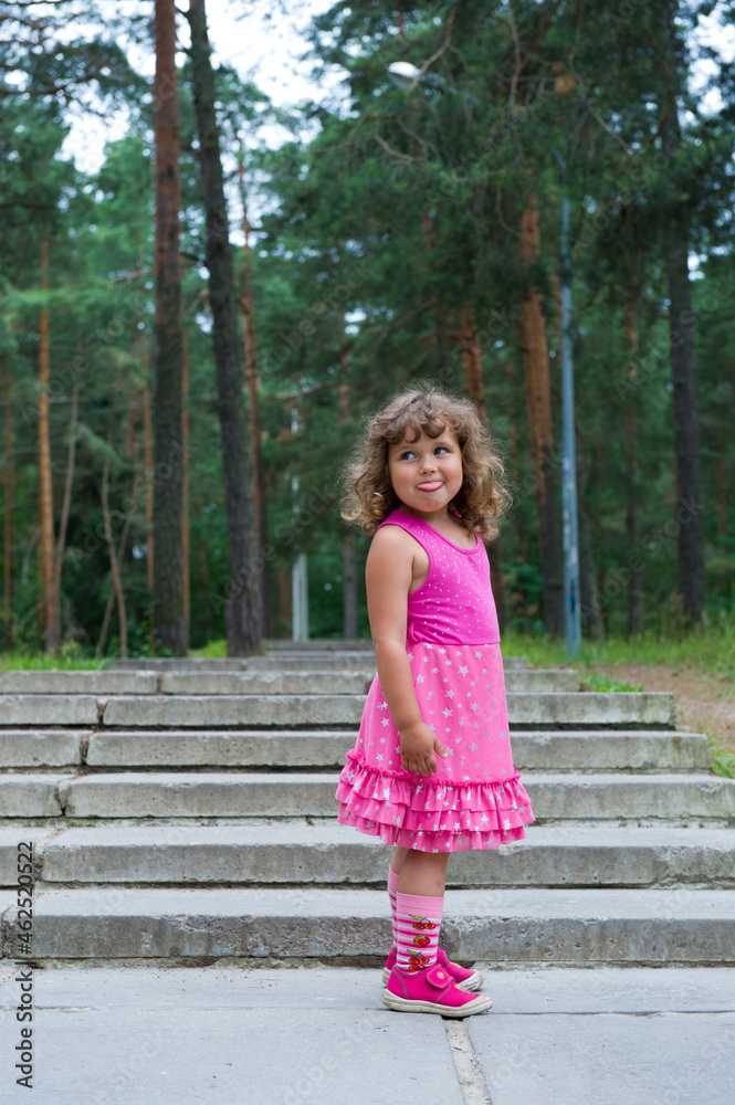 Fototapeta premium little girl in pink dress